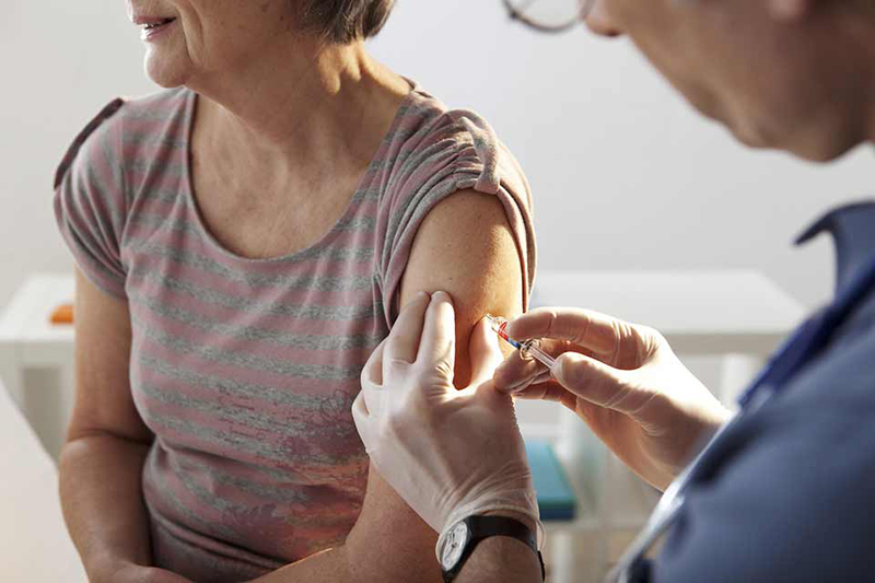 What are the possible risks or side effects of getting the flu vaccine?