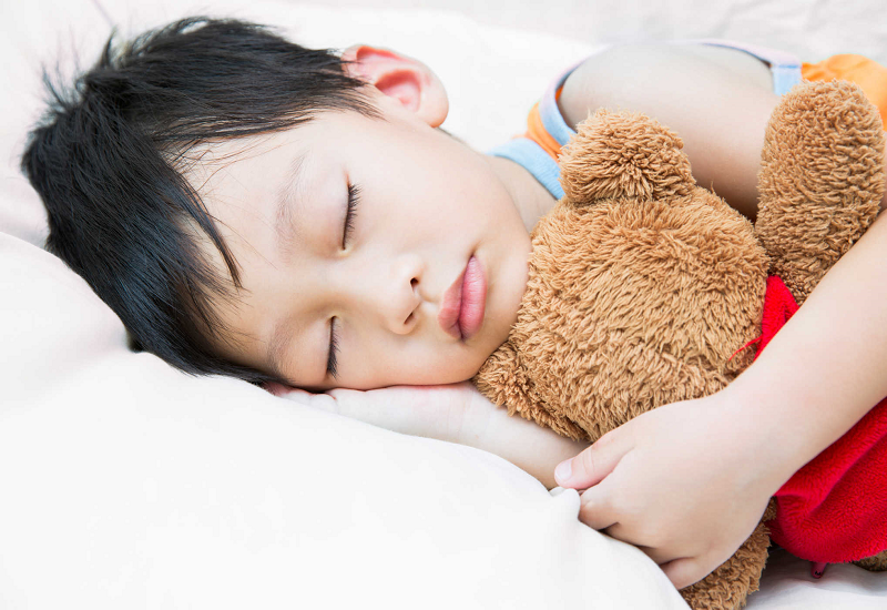 What are the causes of teeth grinding in children during sleep?
