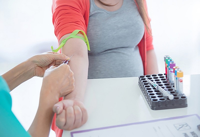 What are the necessary blood tests during the first three months of pregnancy?