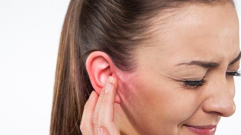 What are the causes of acne appearing in the left ear?