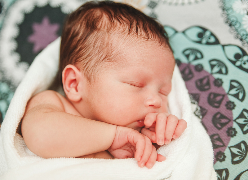 Why do infants sweat excessively from their heads while sleeping?