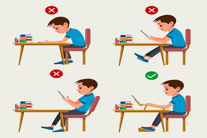 Ngồi học sai tư thế là nguyên nhân rất dễ gặp khiến trẻ bị lồi đốt sống lưng